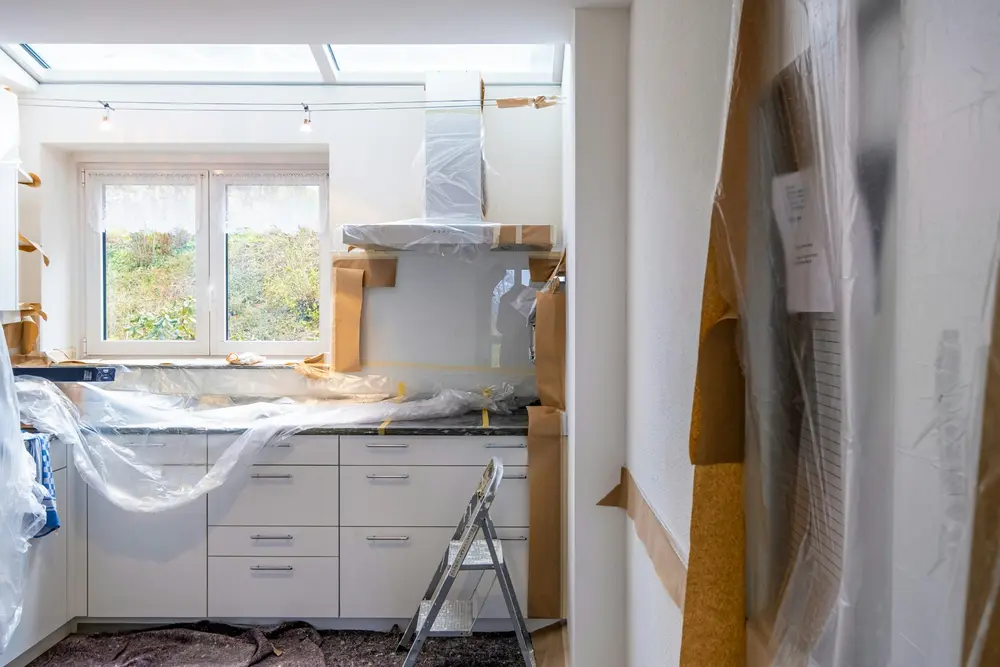Kitchen protected and prepared for painting